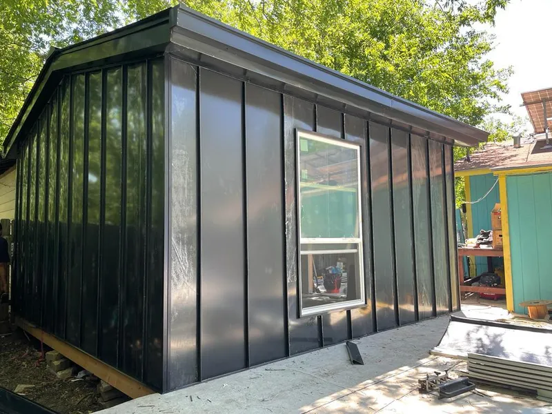 Black standing seam metal wall panels for Roof Inspection in Heber