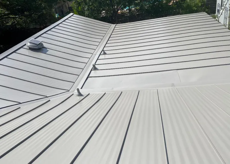 Solar attic fan installed on a metal roof for Roof Ventilation in Heber